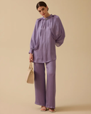 Loose-fitting, flowing tunic with wide sleeves.