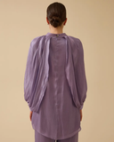 Loose-fitting, flowing tunic with wide sleeves.