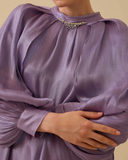 Loose-fitting, flowing tunic with wide sleeves.