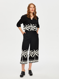 Resort Style Palm Pattern Monochrome Capri Pants by Faik Sönmez