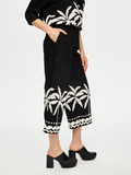 Resort Style Palm Pattern Monochrome Capri Pants by Faik Sönmez